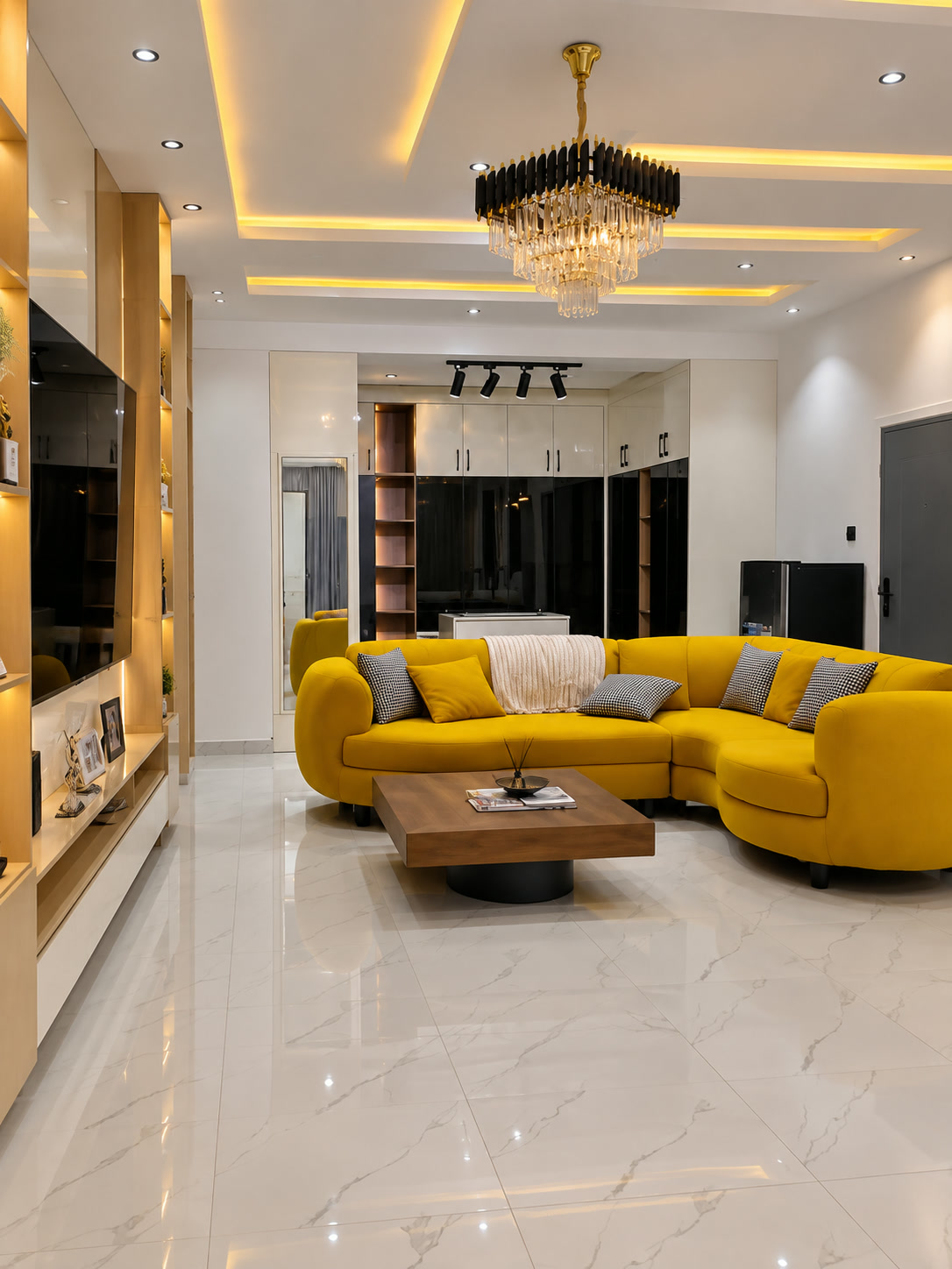 Verish Court guest suite with upholstered bed, lounge seating and warm cove lighting