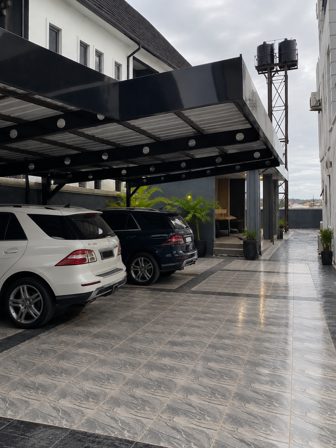 A covered garage with parking for multiple cars.